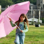 Girl with umbrella by Fiona Campbell